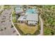 Aerial view of community recreation center, pool, parking, and nearby landscaping at 10179 Milky Way Cir, Sarasota, FL 34241