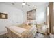 Comfortable bedroom with neutral tones, ceiling fan, and natural light from the window at 10179 Milky Way Cir, Sarasota, FL 34241