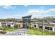 Exterior view of the modern community clubhouse with well-maintained landscaping and ample parking at 10179 Milky Way Cir, Sarasota, FL 34241