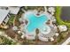 Aerial view of massive resort style pool area with a playground and community building at 10179 Milky Way Cir, Sarasota, FL 34241