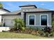 Well-maintained home featuring a manicured lawn and colorful flowerbeds, enhancing curb appeal and showcasing its beauty at 10179 Milky Way Cir, Sarasota, FL 34241