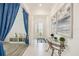 Inviting foyer with tile flooring, elegant decor, and a view of the front door at 10179 Milky Way Cir, Sarasota, FL 34241