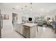 Bright kitchen with island, stainless steel dishwasher and backyard view at 10179 Milky Way Cir, Sarasota, FL 34241