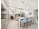 Well-appointed kitchen with a center island, modern lighting, and stylish bar stools at 10179 Milky Way Cir, Sarasota, FL 34241