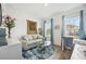Bright living room with a comfortable couch, glass table, and blue accents for a calming atmosphere at 10179 Milky Way Cir, Sarasota, FL 34241