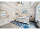 Serene main bedroom with a tray ceiling, elegant decor, and an en-suite bathroom at 10179 Milky Way Cir, Sarasota, FL 34241
