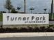 Turner Park at Skye Ranch signage amidst manicured landscaping, welcoming visitors to a beautiful recreational area at 10179 Milky Way Cir, Sarasota, FL 34241