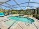 Screened-in pool and spa with outdoor seating, set in a private backyard at 10179 Milky Way Cir, Sarasota, FL 34241