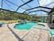 Screened-in pool and spa with an inviting seating area at 10179 Milky Way Cir, Sarasota, FL 34241