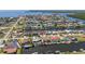 A birds-eye view of a waterfront residence within a serene canal neighborhood with easy access to the open water at 108 Peckham Sw St, Port Charlotte, FL 33952