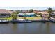 Aerial view showcasing a waterfront home with a private dock and water access at 108 Peckham Sw St, Port Charlotte, FL 33952