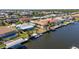 Charming waterfront property with boat dock on canal featuring a screened in porch, surrounded by neighborhood homes at 108 Peckham Sw St, Port Charlotte, FL 33952