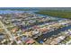 Stunning aerial of canal-lined homes with docks in a coastal community, providing direct access to open waters at 108 Peckham Sw St, Port Charlotte, FL 33952
