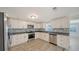 Beautiful new kitchen with stainless steel appliances, modern cabinetry, and backsplash at 108 Peckham Sw St, Port Charlotte, FL 33952