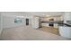Open floorplan with the kitchen and a view of the living room and front door at 108 Peckham Sw St, Port Charlotte, FL 33952