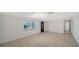 Bright and spacious living room featuring tile floors, fresh paint, and plenty of natural light at 108 Peckham Sw St, Port Charlotte, FL 33952