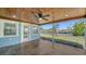 Screened-in patio offers water views, ceiling fan, and tile flooring at 108 Peckham Sw St, Port Charlotte, FL 33952