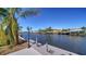 Picturesque view from the dock overlooking the serene waterway with boats at 108 Peckham Sw St, Port Charlotte, FL 33952