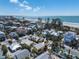 Charming coastal home near the beach with palm trees and beautiful ocean views under a sunny sky at 110 Oak Ave # A, Anna Maria, FL 34216