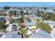 Picturesque coastal neighborhood with colorful homes, palm trees, and a charming yellow house, near the sea at 110 Oak Ave # A, Anna Maria, FL 34216