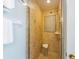 Tiled shower with glass doors and a built-in seat at 110 Oak Ave # A, Anna Maria, FL 34216