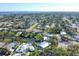 Aerial view of the waterfront neighborhood with lush trees and pristine waterways at 115 65Th Street Nw Ct, Bradenton, FL 34209