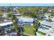 Stunning aerial view of waterfront home with a large pool and well manicured lawn at 115 65Th Street Nw Ct, Bradenton, FL 34209