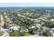 Aerial view of a waterfront community with canals and beautiful single-Gathering homes at 115 65Th Street Nw Ct, Bradenton, FL 34209