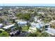 Aerial view showcases the neighborhood with waterfront properties, swimming pools, and lush greenery at 115 65Th Street Nw Ct, Bradenton, FL 34209