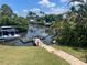 Waterfront backyard with dock and canal access, perfect for boating and enjoying the serene water views at 115 65Th Street Nw Ct, Bradenton, FL 34209