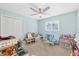 This bedroom features a ceiling fan, a closet and plenty of space for activities at 115 65Th Street Nw Ct, Bradenton, FL 34209