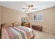 This cozy bedroom includes a ceiling fan, window, fish tank, bed and wooden chest at 115 65Th Street Nw Ct, Bradenton, FL 34209