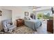Comfortable bedroom with a ceiling fan, ample natural light, and a sliding glass door at 115 65Th Street Nw Ct, Bradenton, FL 34209