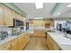 This kitchen has wooden cabinets, white countertop and stainless steel appliances at 115 65Th Street Nw Ct, Bradenton, FL 34209