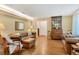 Cozy living room featuring hardwood floors, leather furniture and stylish decor at 115 65Th Street Nw Ct, Bradenton, FL 34209