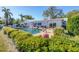Inviting in-ground pool is surrounded by lush landscaping at 115 65Th Street Nw Ct, Bradenton, FL 34209