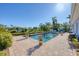 An enticing in-ground pool surrounded by a brick patio offers a refreshing backyard oasis at 115 65Th Street Nw Ct, Bradenton, FL 34209