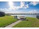 Backyard with a seating area and a beautiful view of the lake at 11659 Little River Way, Parrish, FL 34219