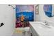 Bathroom featuring shower with a beautiful scenic shower curtain and a modern vanity at 11659 Little River Way, Parrish, FL 34219