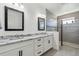 Bathroom with granite counters, dual sinks, and a large shower at 11659 Little River Way, Parrish, FL 34219
