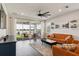 Bright living room with a great view of the backyard patio and lake at 11659 Little River Way, Parrish, FL 34219