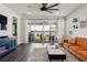 Living room has a modern design with large sliding glass doors at 11659 Little River Way, Parrish, FL 34219