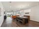 Open living space with backyard patio and lake view, wood floors, and neutral colors at 11659 Little River Way, Parrish, FL 34219