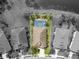 Aerial view of home with screened-in pool and pond, showcasing the property's layout and surroundings at 11742 Forest Park Cir, Bradenton, FL 34211