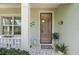 Inviting front entrance with decorative accents and a glimpse into the home's interior at 11742 Forest Park Cir, Bradenton, FL 34211