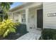 Charming front entrance with stone walkway, decorative plants, and house number visible at 11742 Forest Park Cir, Bradenton, FL 34211