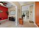 Hallway showcasing the home's open layout with views of the living room and office at 11742 Forest Park Cir, Bradenton, FL 34211