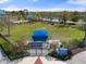 Overhead view of a community playground with a covered picnic area and green space for recreational activities at 11742 Forest Park Cir, Bradenton, FL 34211