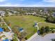 An aerial view of a large recreational field in the community park offers space for a variety of outdoor activities at 11742 Forest Park Cir, Bradenton, FL 34211