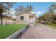 Charming single-story home featuring a well-manicured lawn and a quaint walkway leading to the front door at 11936 82Nd E St, Parrish, FL 34219